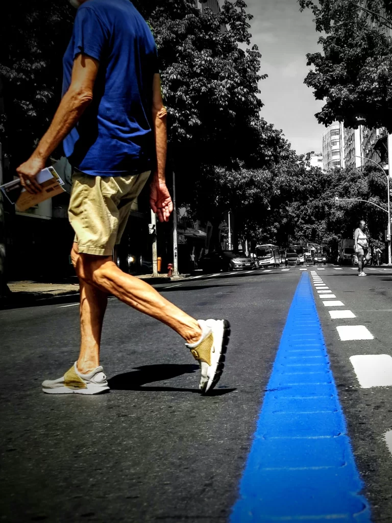 man_walking_across_barata_ribeiro_in_copacabana-768x1024