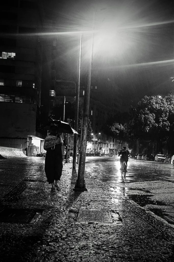 woman_walking_in_the_rain_copacabana_rio_21-682x1024